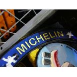 Two x curved Michelin signs