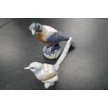 A Royal Copenhagen 'Barn Swallow' bird and a small Lladro bird