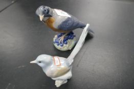 A Royal Copenhagen 'Barn Swallow' bird and a small Lladro bird