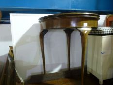 Mahogany circular fold over card table with green baize on cabriole supports