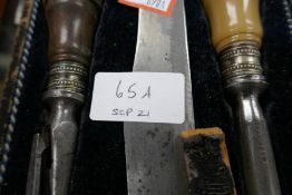 A Victorian horn handled carving set