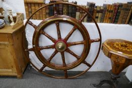 An old large ships wheel having brass inlay, 115cm