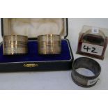 Silver napkin rings, two cased marked silver, one Sheffield 1944 James Dixon and Sons Ltd. Another B