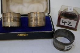 Silver napkin rings, two cased marked silver, one Sheffield 1944 James Dixon and Sons Ltd. Another B