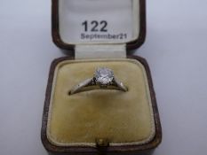 White metal solitaire diamond ring, approx 0.70 Carat, brilliant cut Cathedral set diamond with insc