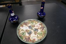 A Moorcroft Anniversary plate 1998, 22cms and a small pair of Doulton Lambeth blue glaze vases