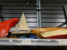 Wooden model yacht with sails