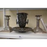 An antique plated on copper vase and stand having pierced decoration, and a pair of candlesticks
