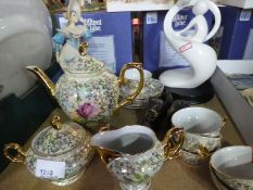 A small amount of decorative tea ware to include tea pot, cups, saucers, white modern statue of a pe