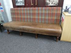A large modern upholstered settle