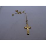 9ct yellow gold fine neckchain hung with a 9ct yellow gold cross with engraved detail, both marked,