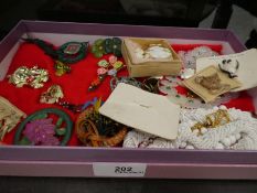 Collection of costume jewellery, mainly brooches and box of shell cameos, unmounted