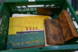 A small tray of ephemera relating to Cunard including a R.M.S. Mauretania booklet, other ephemera an