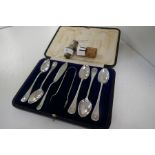 A cased set of five silver teaspoons, a silver small knife and a pair of silver tongs, hallmarked Sh