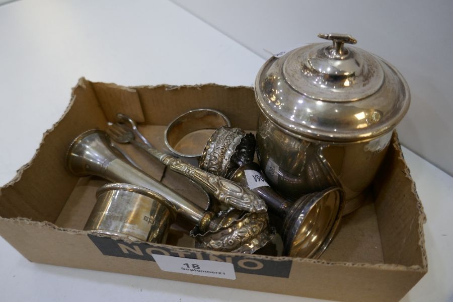 A mixed lot comprising a silver tea caddy Birmingham 1919 A and J Zimmerman Ltd, four silver napkin