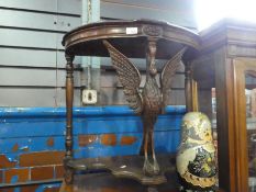 Vintage mahogany demi lune side table supported by carved swan and an undertier