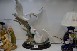 A Lladro figure of two Cranes no. 1456, 51cms high, on oval wooden base