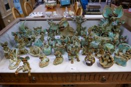A quantity of YARE pottery dragons, some damaged