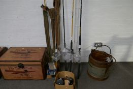 A quantity of fishing rods and reels,(sea and fly examples), including meters, Penn Daiwa and Allcoc