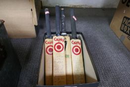 Four miniature cricket bats, all signed, probably from Hampshire County teams including Robin Smith