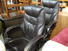 2 Brown leather armchairs on chrome supports