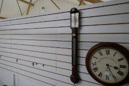 A Georgian mahogany stick barometer by George Strebbing
