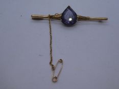 14K bar brooch set with a tear shaped amethyst, 6.4g approx, 6cm, with safety chain, marked 14K