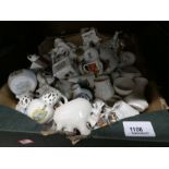 A small box full of crested ware