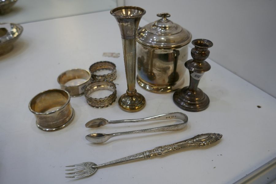 A mixed lot comprising a silver tea caddy Birmingham 1919 A and J Zimmerman Ltd, four silver napkin - Image 4 of 4