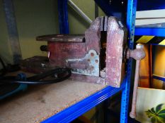 A workshop vice made of wood with metal components, stamped London