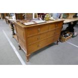 A 1920s oak chest of drawers on cabriole legs 122cm