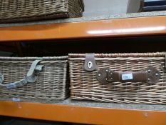 Three wicker picnic baskets, all with contents