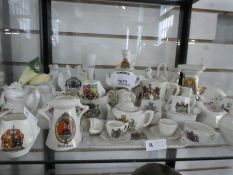 Shelf of various crested china ware