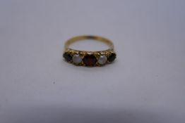 18ct yellow gold ring set with garnets an seed pearls, marked 18, 2.9g approx