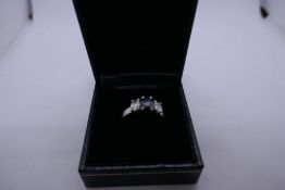 Pretty 18ct white gold trilogy ring set with central oval black diamond flanked two white diamonds,