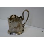 A Russian silver cup of decorative design and a pierced pattern, pretty handle and engraved foliate