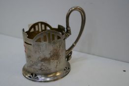 A Russian silver cup of decorative design and a pierced pattern, pretty handle and engraved foliate