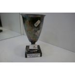 A marked white metal trophy cup on a black marble base, Coupe de Bordeaux, a French football team tr