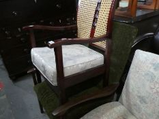 Mahogany framed cane back armchair with cream seat cushion