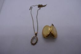 9ct yellow gold fine neckchain AF hung with a pendant set possible moonstone together with yellow me