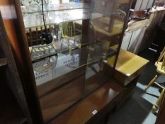 Mid century teak display cabinet with glass sliding doors above drawer and bedside table