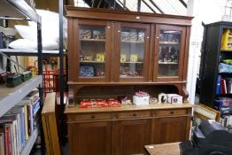 An early 20th century oak dresser having glazed top with drawers and cupboards below, 177 cms
