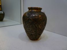 A silver tested higher grade Eastern pot, heavily decorated with some chasing and some repoussed in