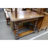 A late 19th century oak side table having one drawer with carved decoration on barley twist legs, 10