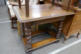 A late 19th century oak side table having one drawer with carved decoration on barley twist legs, 10