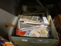 A suitcase and basket containing ephemera  to include newspapers, writing books, clothes patterns po