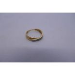 18ct crossover design band ring inset with 7 diamonds, 0.15 carat, marked 750, 1.8g approx