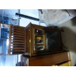 Carved mahogany and mahogany hall cupboard with bevelled mirror panels and glass door