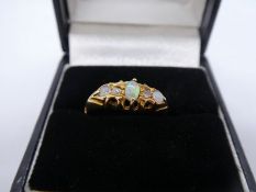 18ct yellow gold dress ring set with white opals and diamonds, size P, marked 18, 2.6g approx