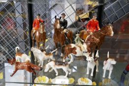 Two matching Beswick huntsman figures having red jackets - a similar figure of lady, a Beswick pony